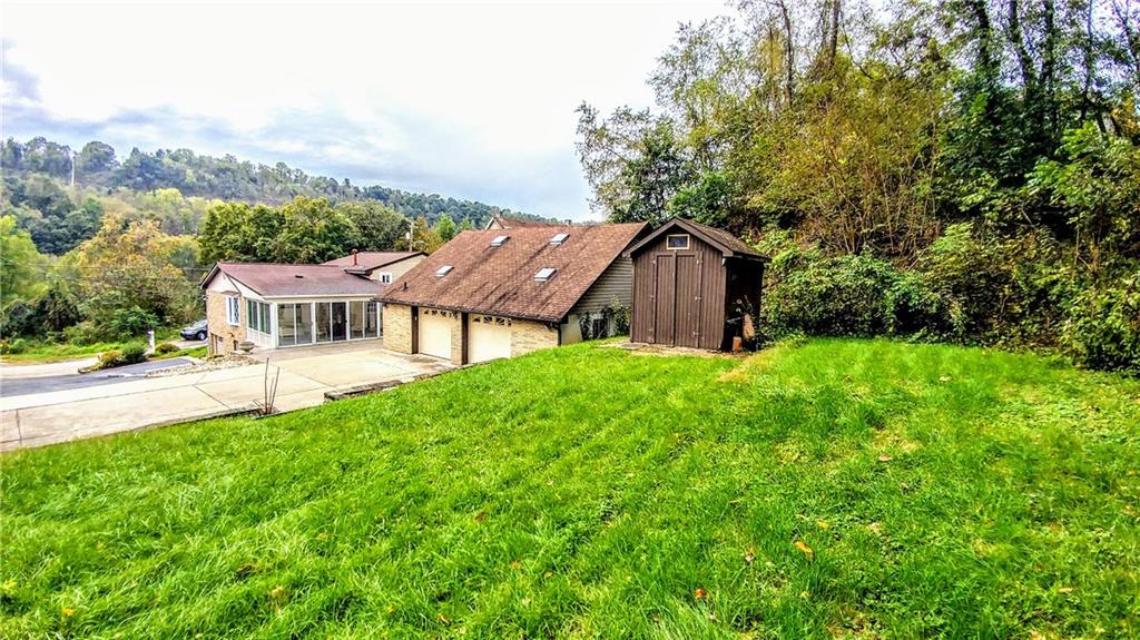 148 Morgan Hill Road Cuddy, PA 15031 - Photo 5 of 25 Wow, look at his nice flat yard in the back! Complete with shed for all your yard tools!