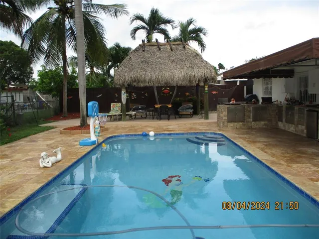 a view of swimming pool with chairs
