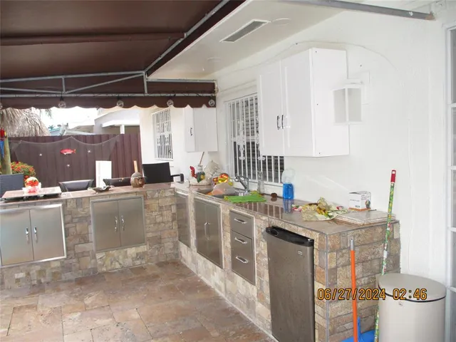 a kitchen with a sink and cabinets
