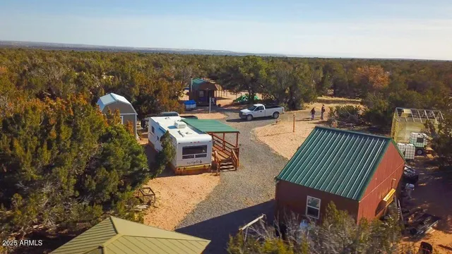 a view of a balcony with two chairs and a table