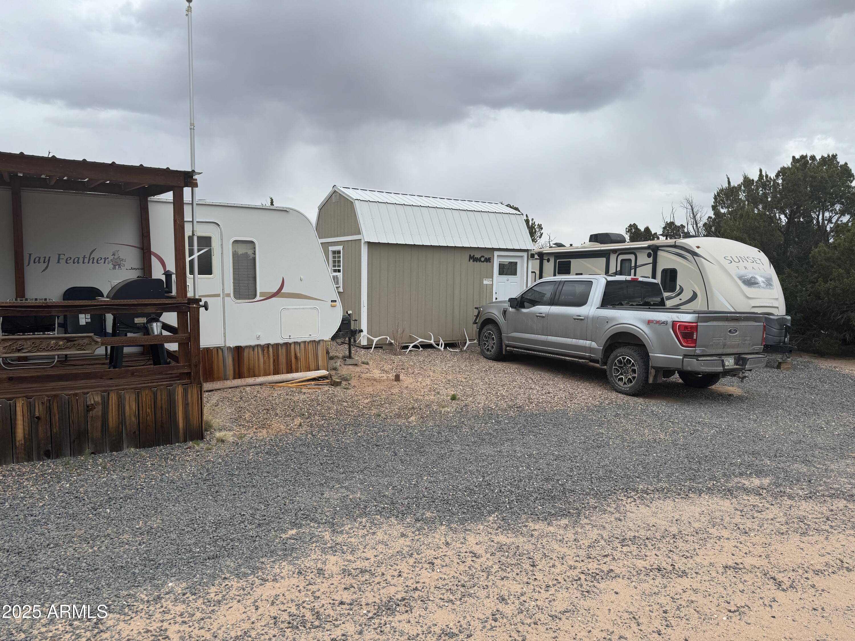 Lot 64 Sierra Mountain Ranch, Unit 64 St. Johns, AZ 85936 - Photo 13 of 38 a car parked in parking