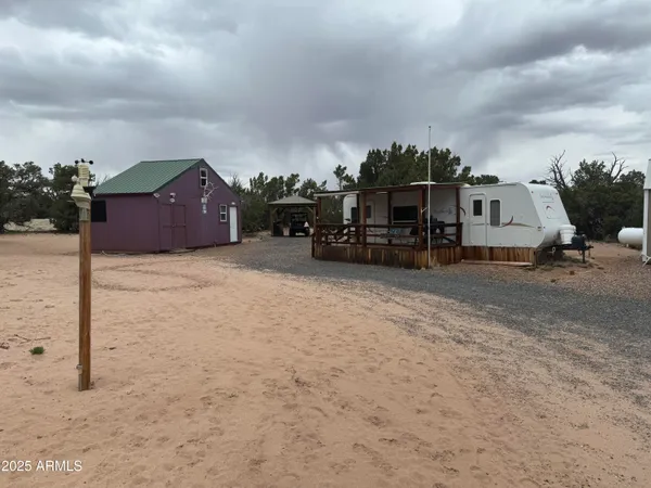 a view of a house in the middle of a yard