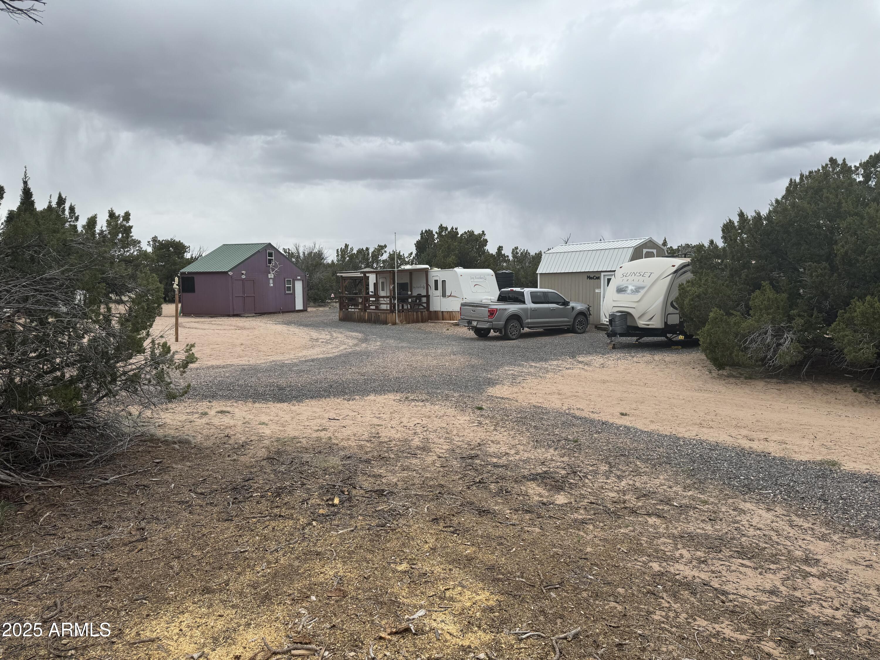 Lot 64 Sierra Mountain Ranch, Unit 64 St. Johns, AZ 85936 - Photo 28 of 38 a view of a dirt road and a building