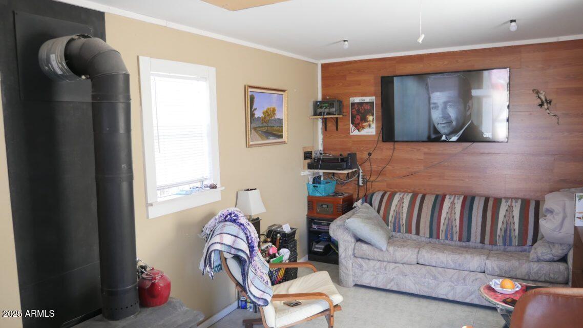 Lot 64 Sierra Mountain Ranch, Unit 64 St. Johns, AZ 85936 - Photo 5 of 38 a living room with furniture and a flat screen tv