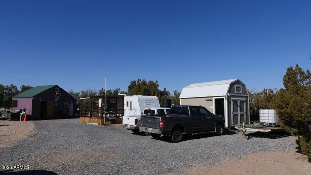 a view of a house in the middle of a yard