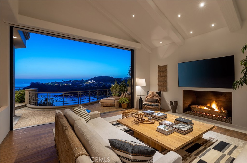 199 Emerald Bay Laguna Beach, CA 92651 - Photo 8 of 23 a living room with furniture and a fireplace