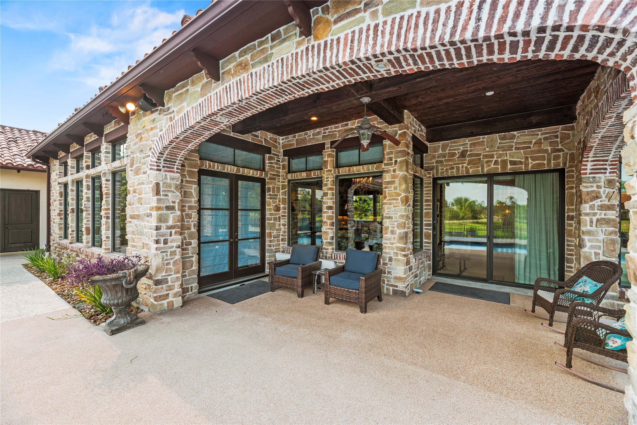 7715 Firethorne Creek Court Spring, TX 77389 - Photo 46 of 50 a view of a chair and tables in patio of the house