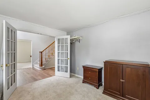 an empty room with windows and natural light