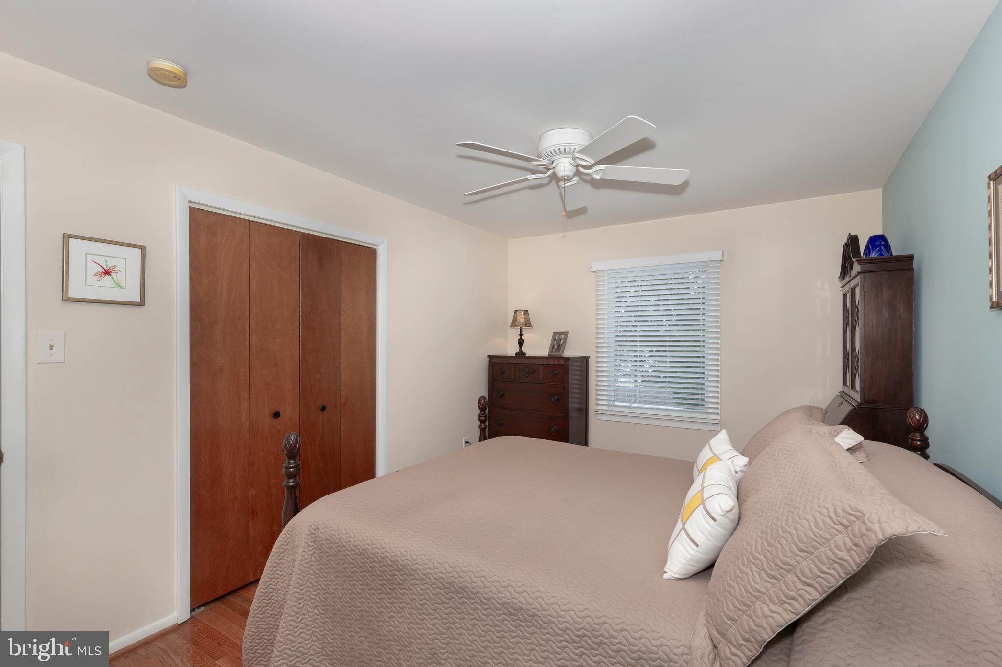 4316 Utz Road Hampstead, MD 21074 - Photo 21 of 82 a bedroom with a large bed and a chandelier
