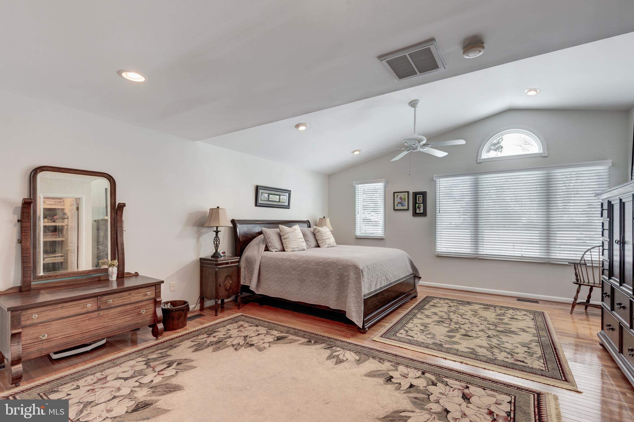 4316 Utz Road Hampstead, MD 21074 - Photo 22 of 82 a spacious bedroom with a bed a dresser with wooden floor