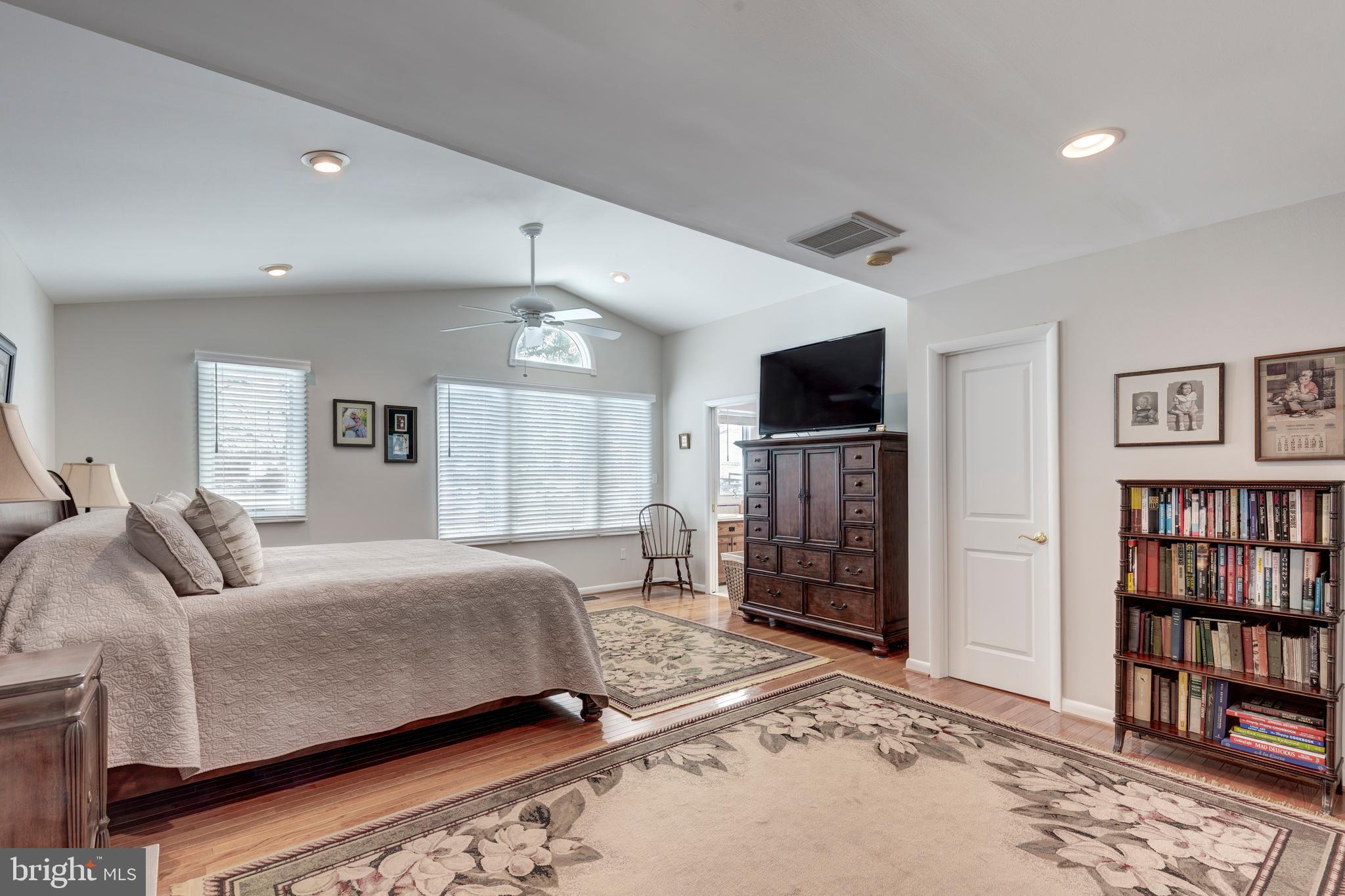 4316 Utz Road Hampstead, MD 21074 - Photo 23 of 82 a bedroom with a large bed a flat tv screen and closet