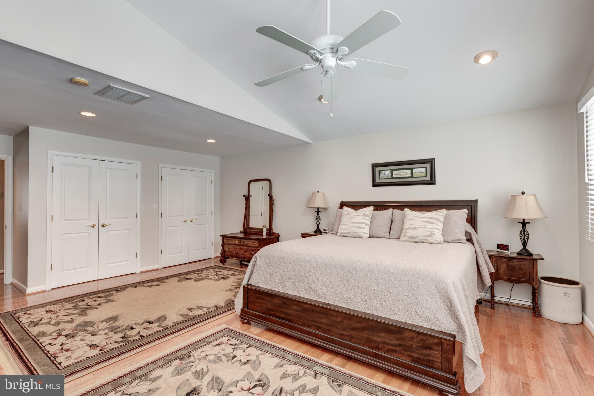 4316 Utz Road Hampstead, MD 21074 - Photo 25 of 82 a bedroom with a large bed and a chandelier