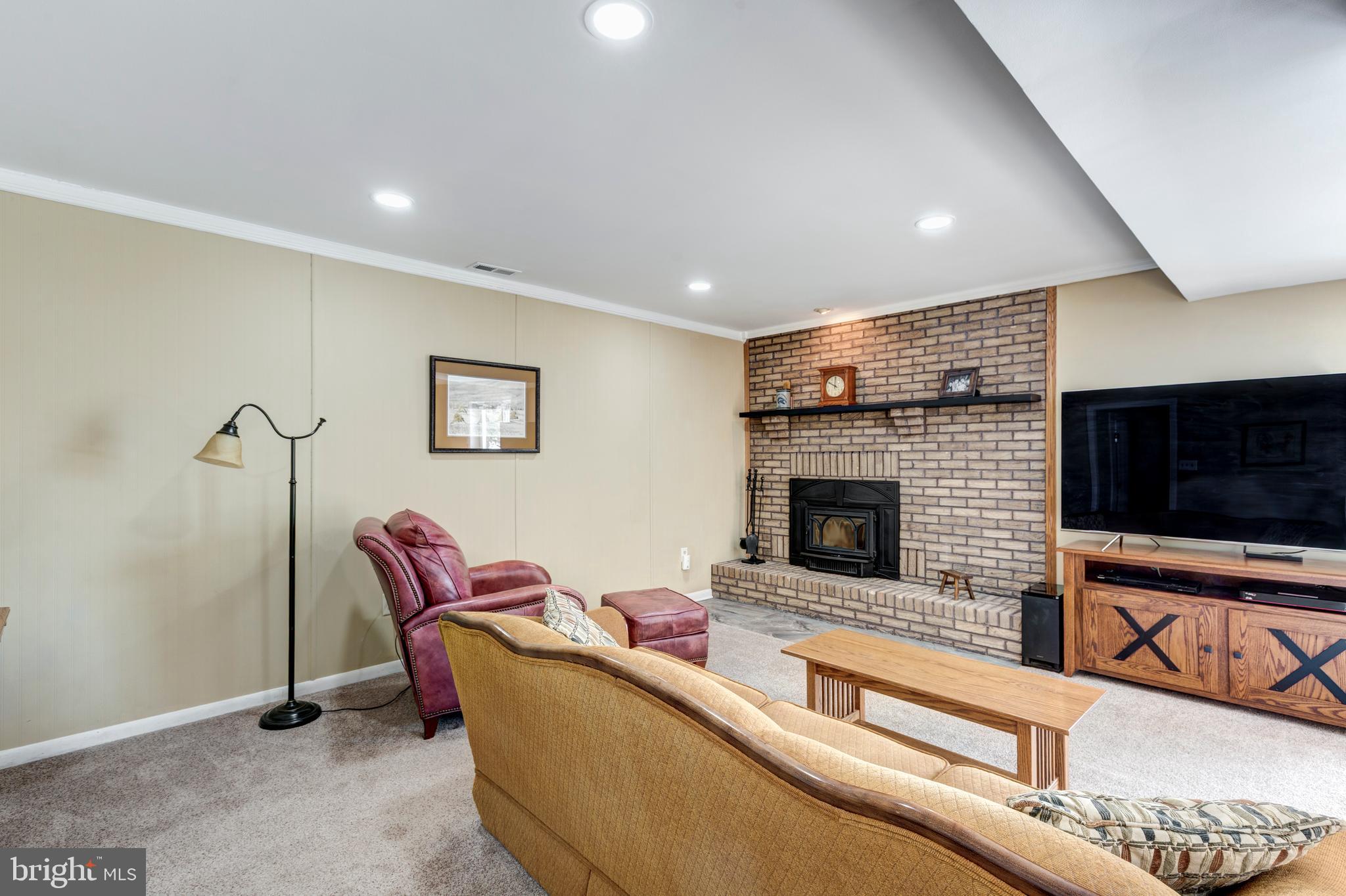 4316 Utz Road Hampstead, MD 21074 - Photo 36 of 82 a living room with furniture and a fireplace