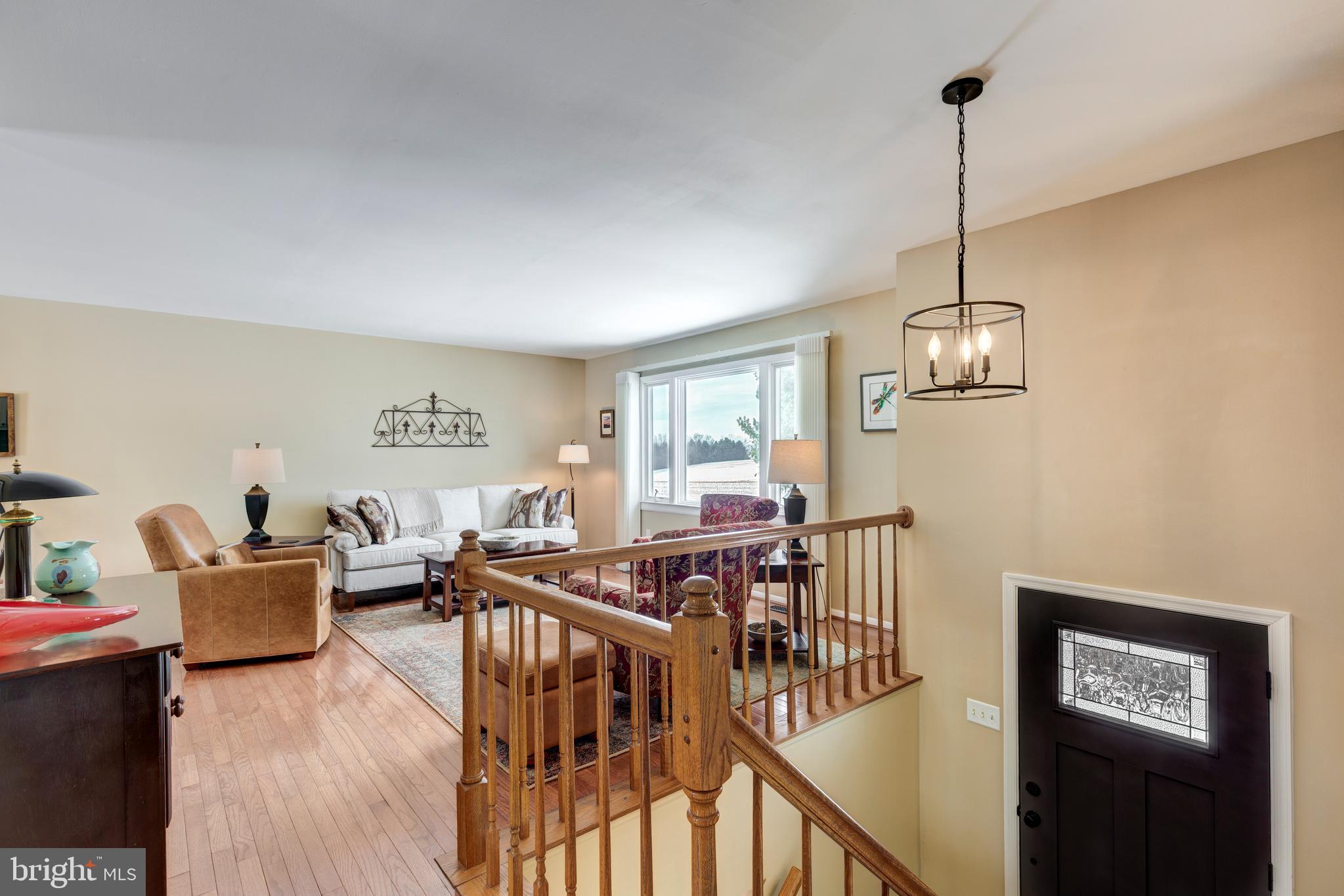 4316 Utz Road Hampstead, MD 21074 - Photo 5 of 82 a view of a livingroom with furniture wooden floor and windows