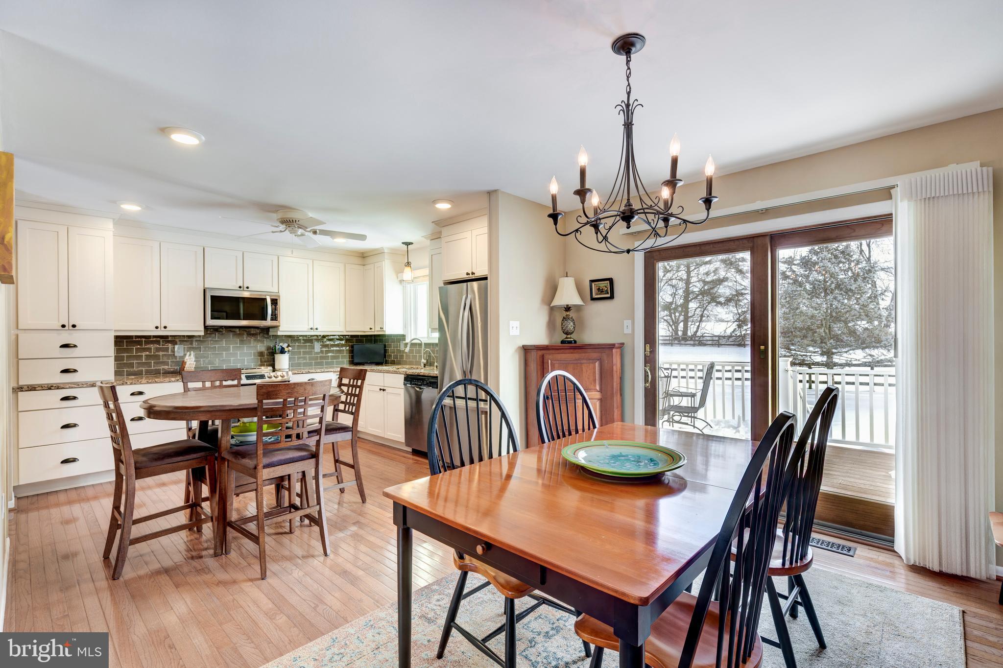 4316 Utz Road Hampstead, MD 21074 - Photo 10 of 82 a view of a dining room with furniture window and wooden floor