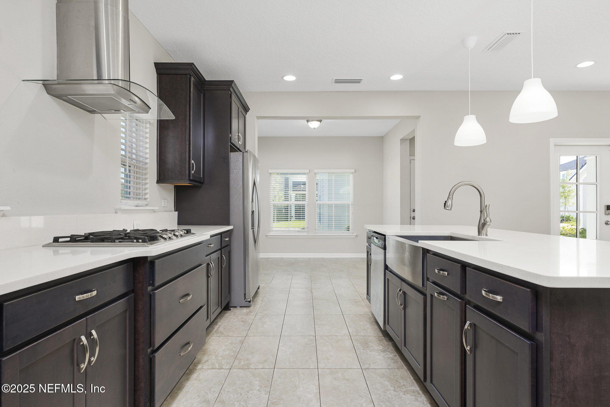 299 Clarys Run St. Augustine, FL 32092 - Photo 12 of 39 a kitchen with sink stove and cabinets
