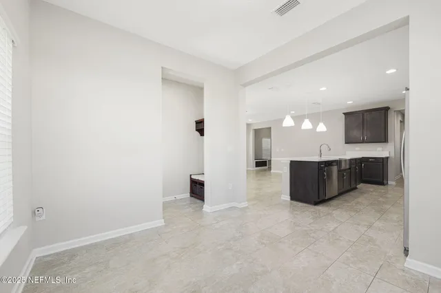 a kitchen with a cabinets and a microwave