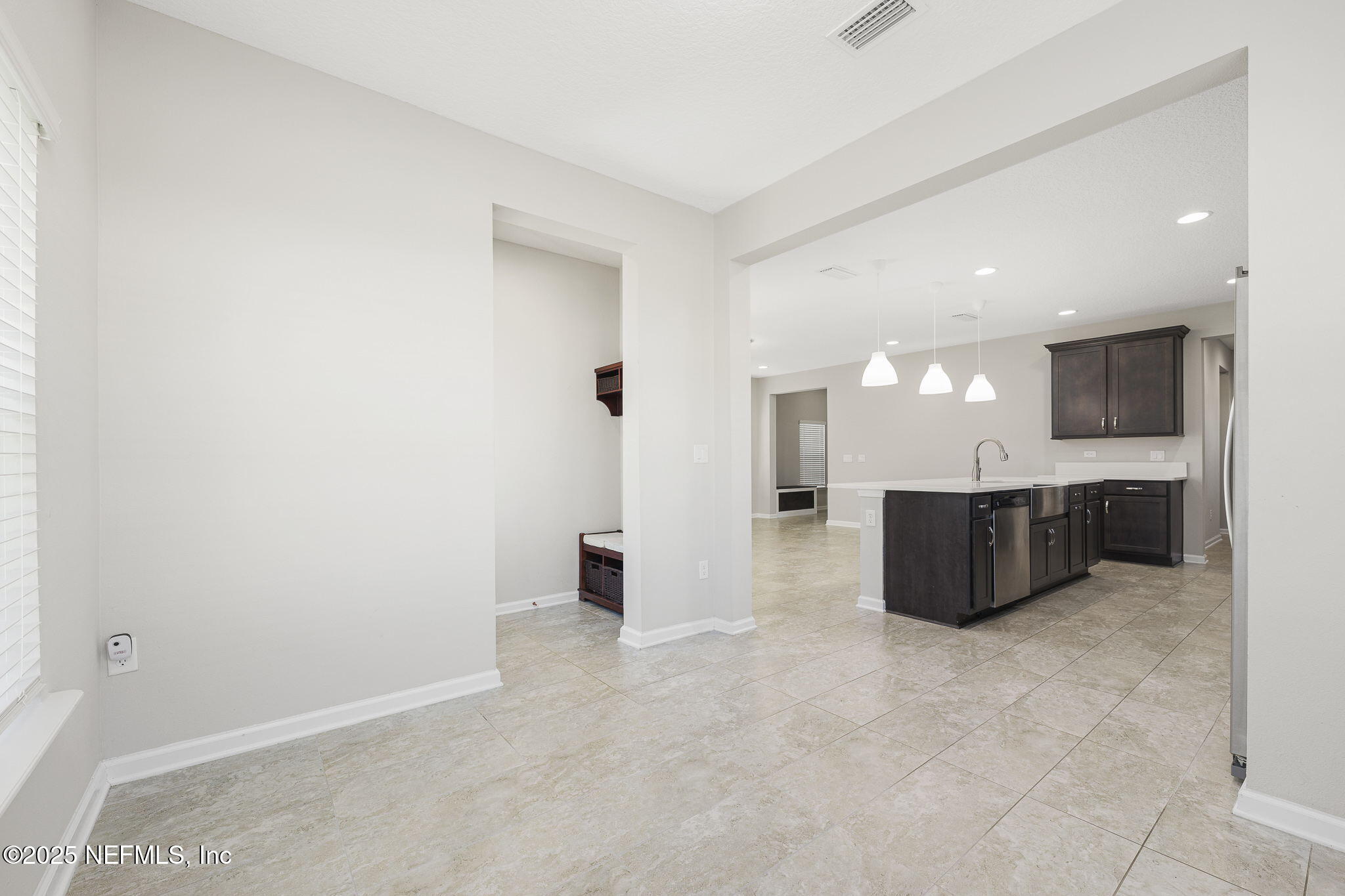 299 Clarys Run St. Augustine, FL 32092 - Photo 13 of 39 a view of a big room with kitchen and windows