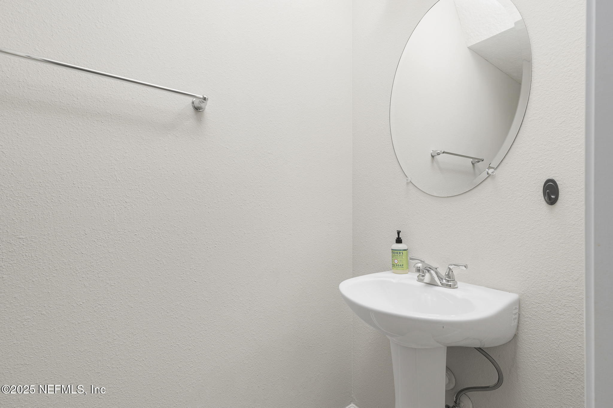 299 Clarys Run St. Augustine, FL 32092 - Photo 16 of 39 a bathroom with a sink a mirror and a shower
