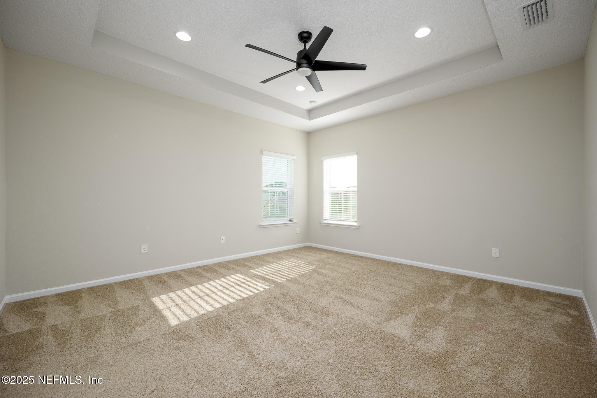 299 Clarys Run St. Augustine, FL 32092 - Photo 21 of 39 an empty room with windows and ceiling fan