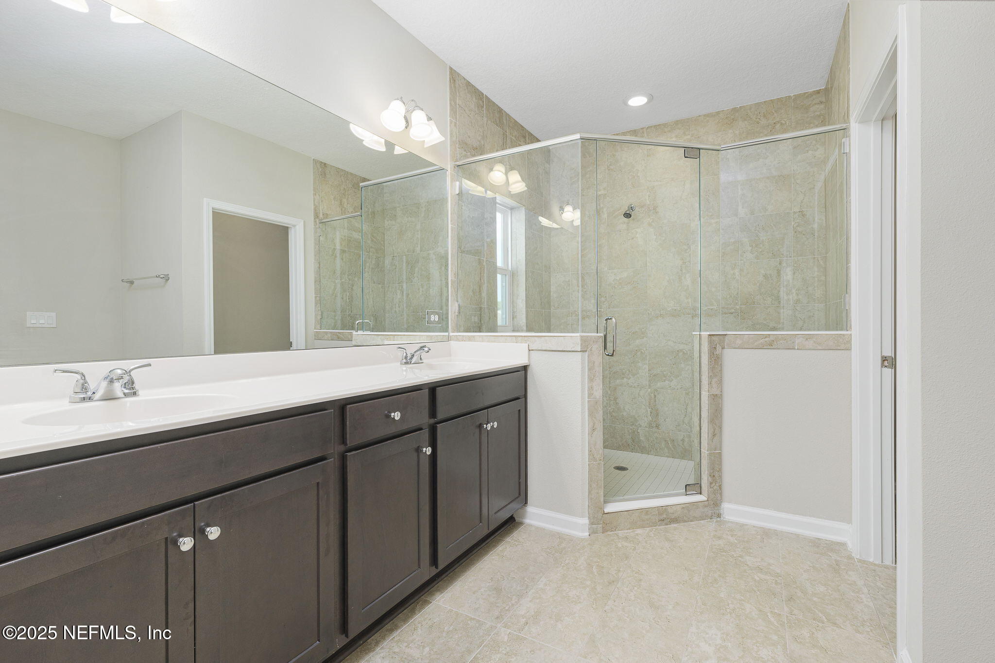 299 Clarys Run St. Augustine, FL 32092 - Photo 23 of 39 a bathroom with a double vanity sink mirror double and shower