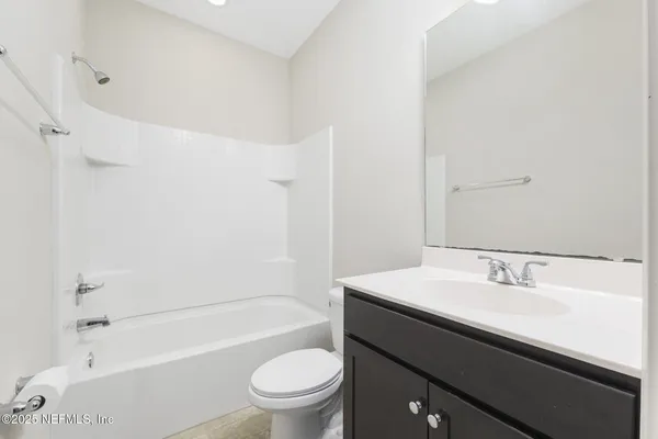 a bathroom with a sink a toilet and a bathtub