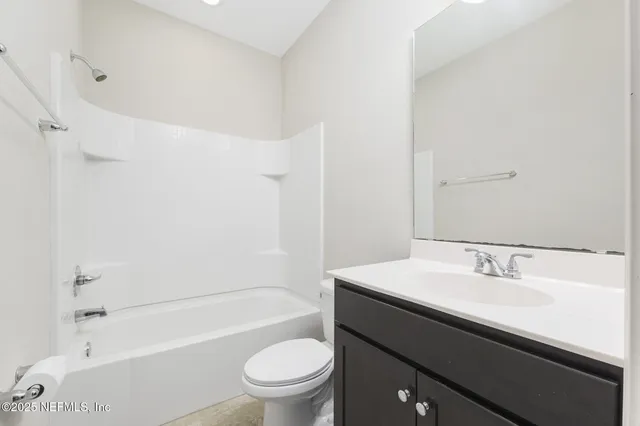 a bathroom with a sink a toilet and a bathtub