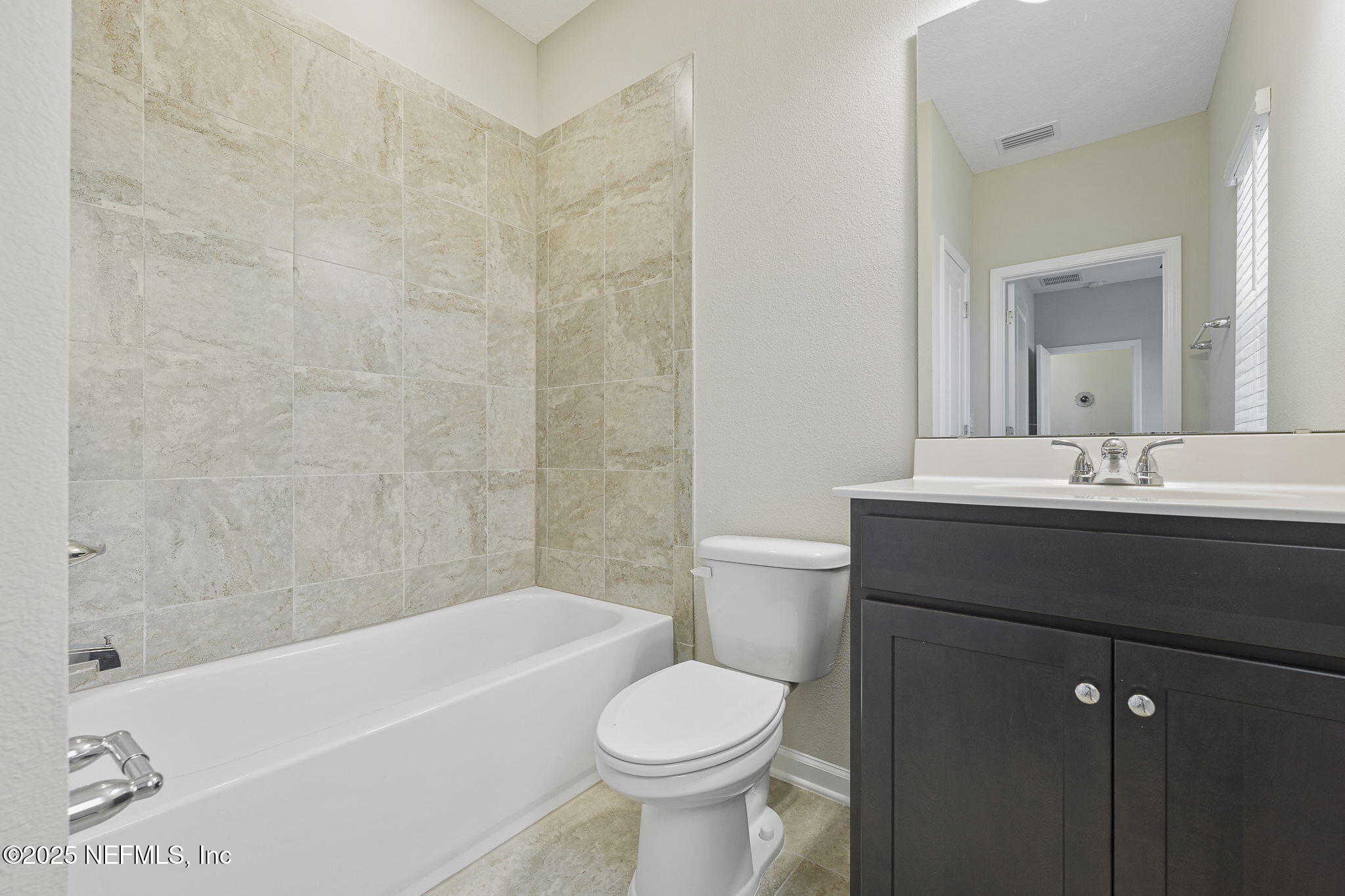 299 Clarys Run St. Augustine, FL 32092 - Photo 30 of 39 a bathroom with a sink a toilet and a bathtub