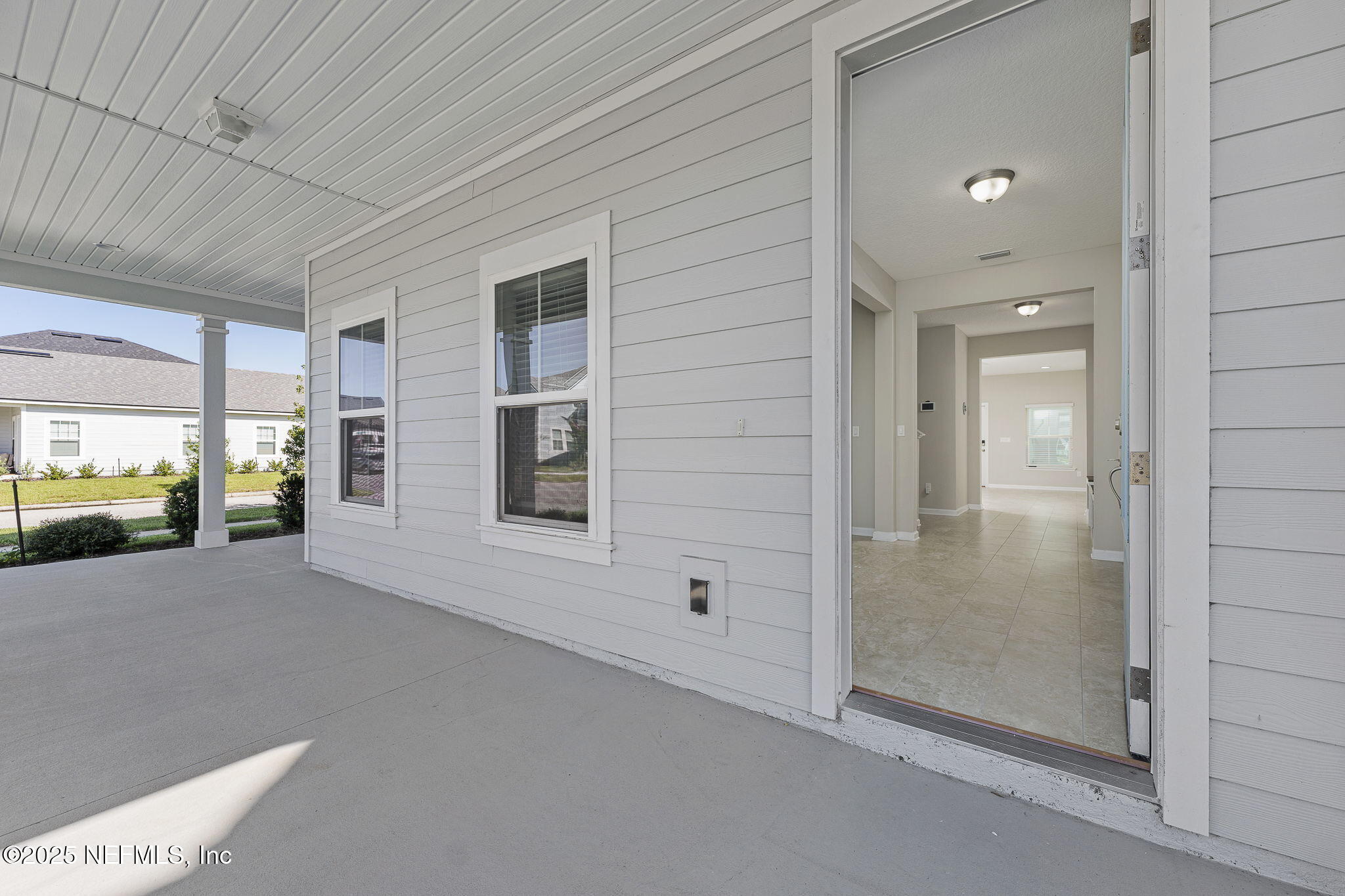 299 Clarys Run St. Augustine, FL 32092 - Photo 3 of 39 a view of a hallway with bathroom and front door