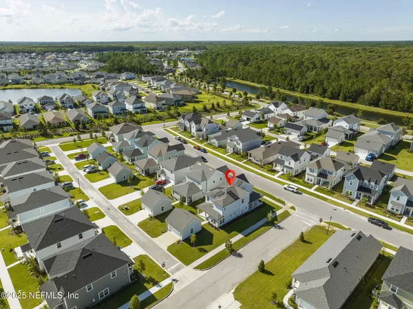 an aerial view of residential house with ocean view
