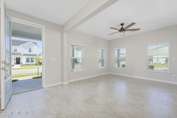 a view of an empty room with a window
