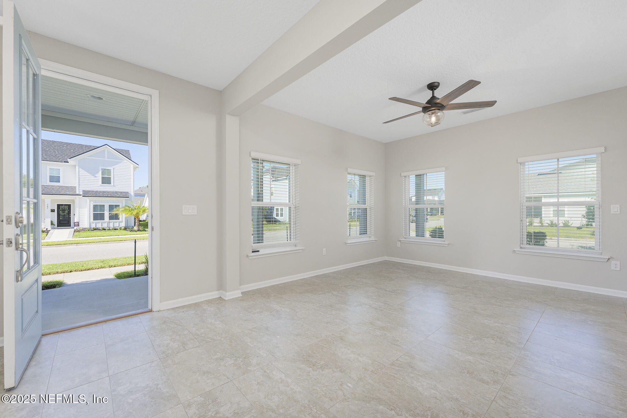 299 Clarys Run St. Augustine, FL 32092 - Photo 4 of 39 a view of room with window and wooden floor