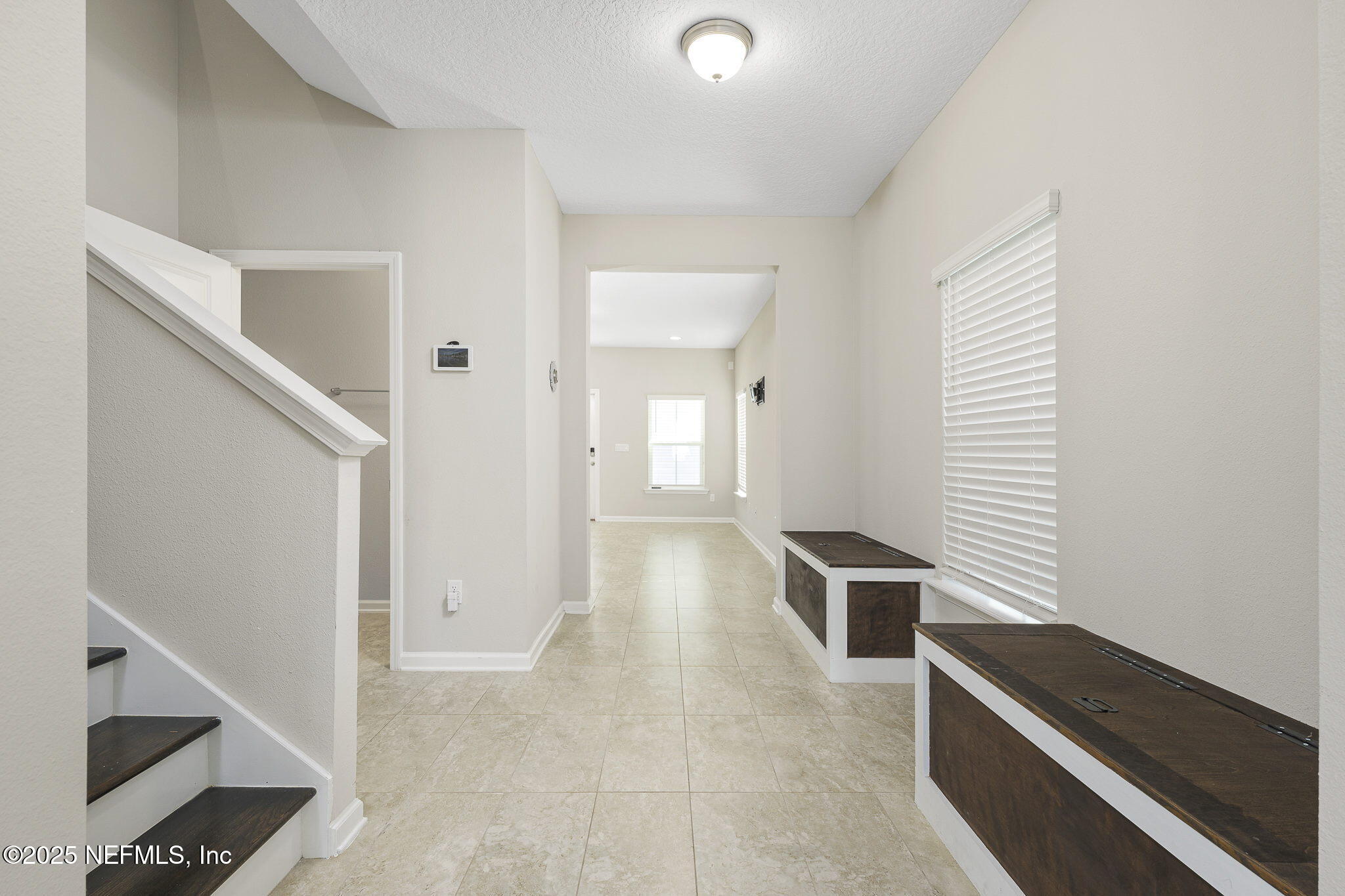 299 Clarys Run St. Augustine, FL 32092 - Photo 6 of 39 a view of a hallway with entryway and stairs