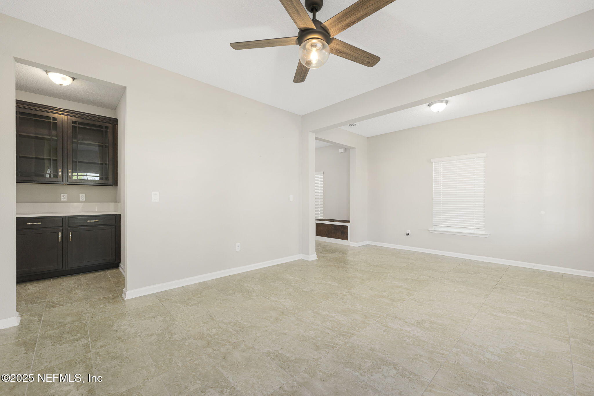 299 Clarys Run St. Augustine, FL 32092 - Photo 7 of 39 a view of an empty room with a kitchen