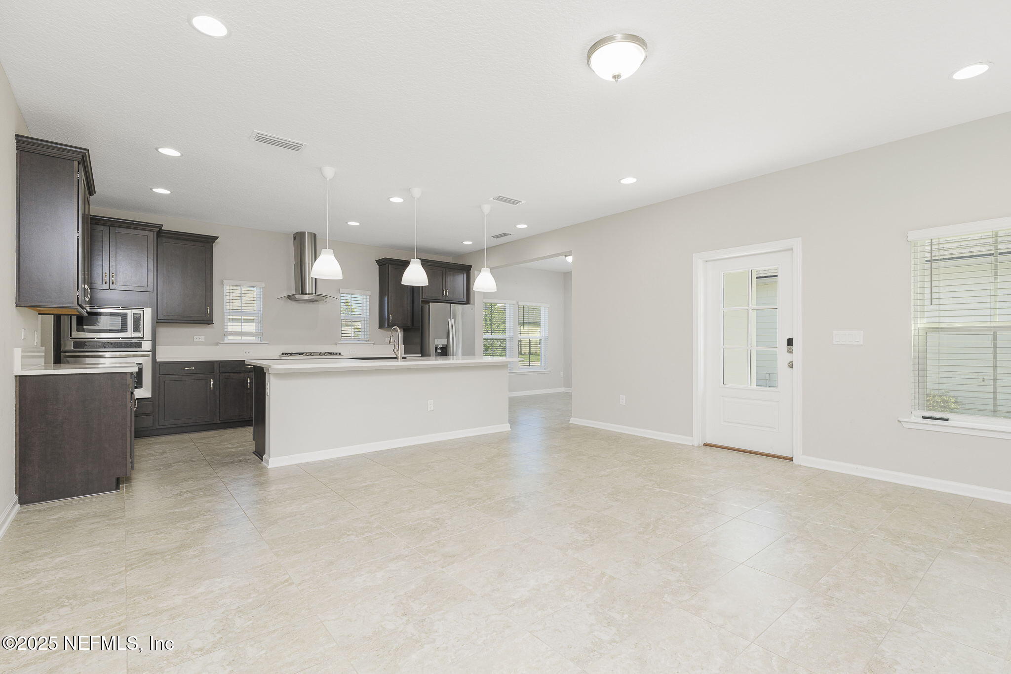 299 Clarys Run St. Augustine, FL 32092 - Photo 8 of 39 a view of kitchen with kitchen island a sink stainless steel appliances and cabinets
