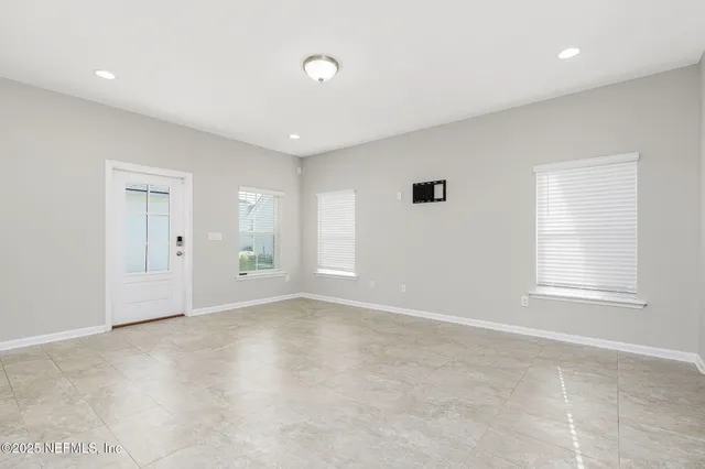 a kitchen with kitchen island a sink stainless steel appliances and cabinets