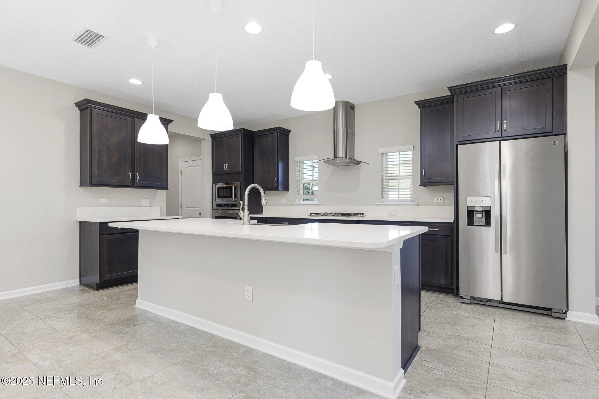 299 Clarys Run St. Augustine, FL 32092 - Photo 10 of 39 a kitchen with kitchen island a sink stainless steel appliances and cabinets