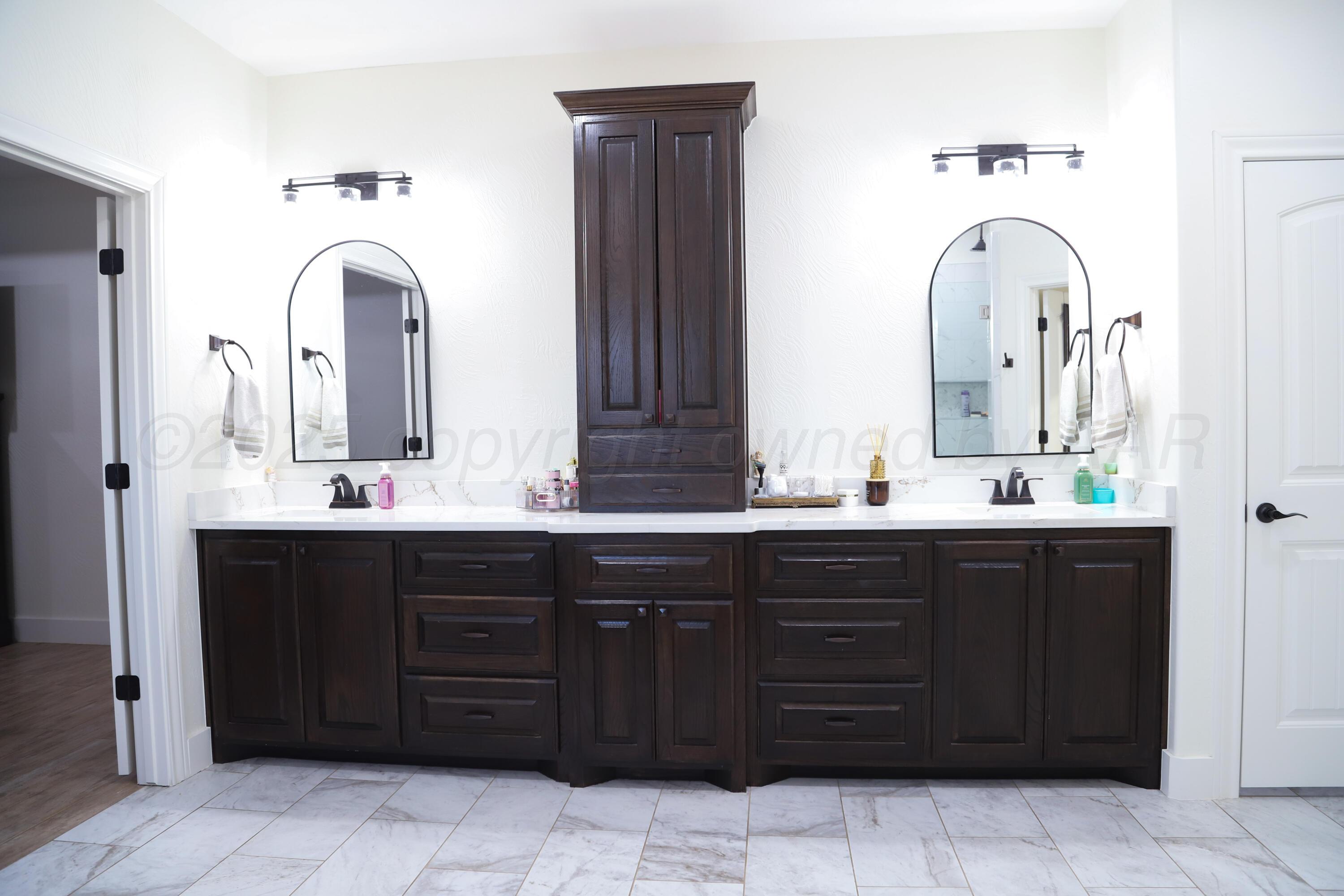 11501 Cutter Lane Amarillo, TX 79118 - Photo 14 of 24 a bathroom with a double vanity sink and a mirror