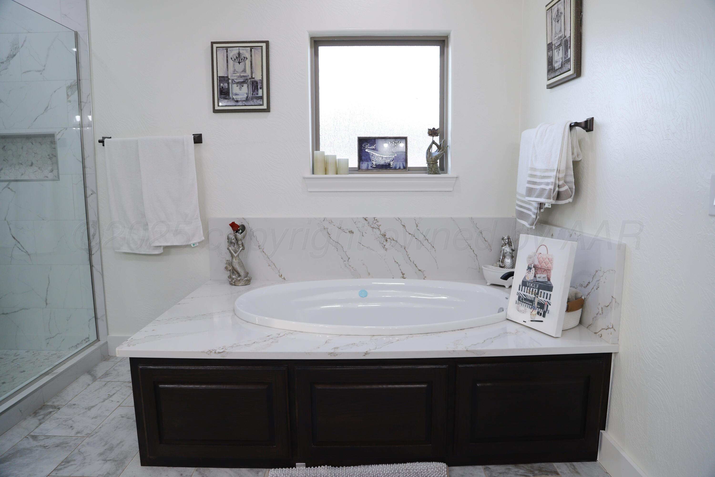 11501 Cutter Lane Amarillo, TX 79118 - Photo 16 of 24 a bathroom with a sink and a mirror