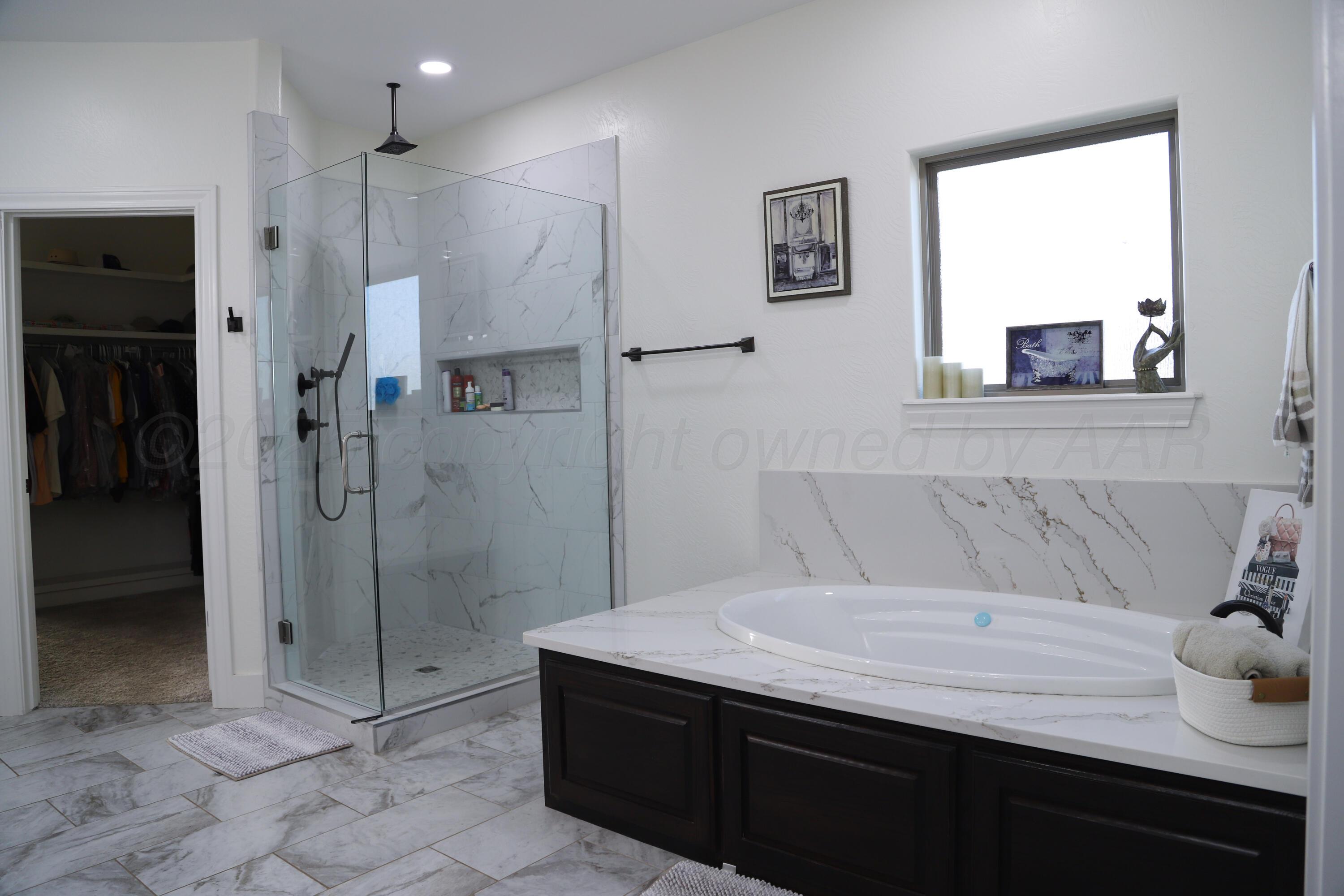 11501 Cutter Lane Amarillo, TX 79118 - Photo 17 of 24 a bathroom with a sink and a mirror