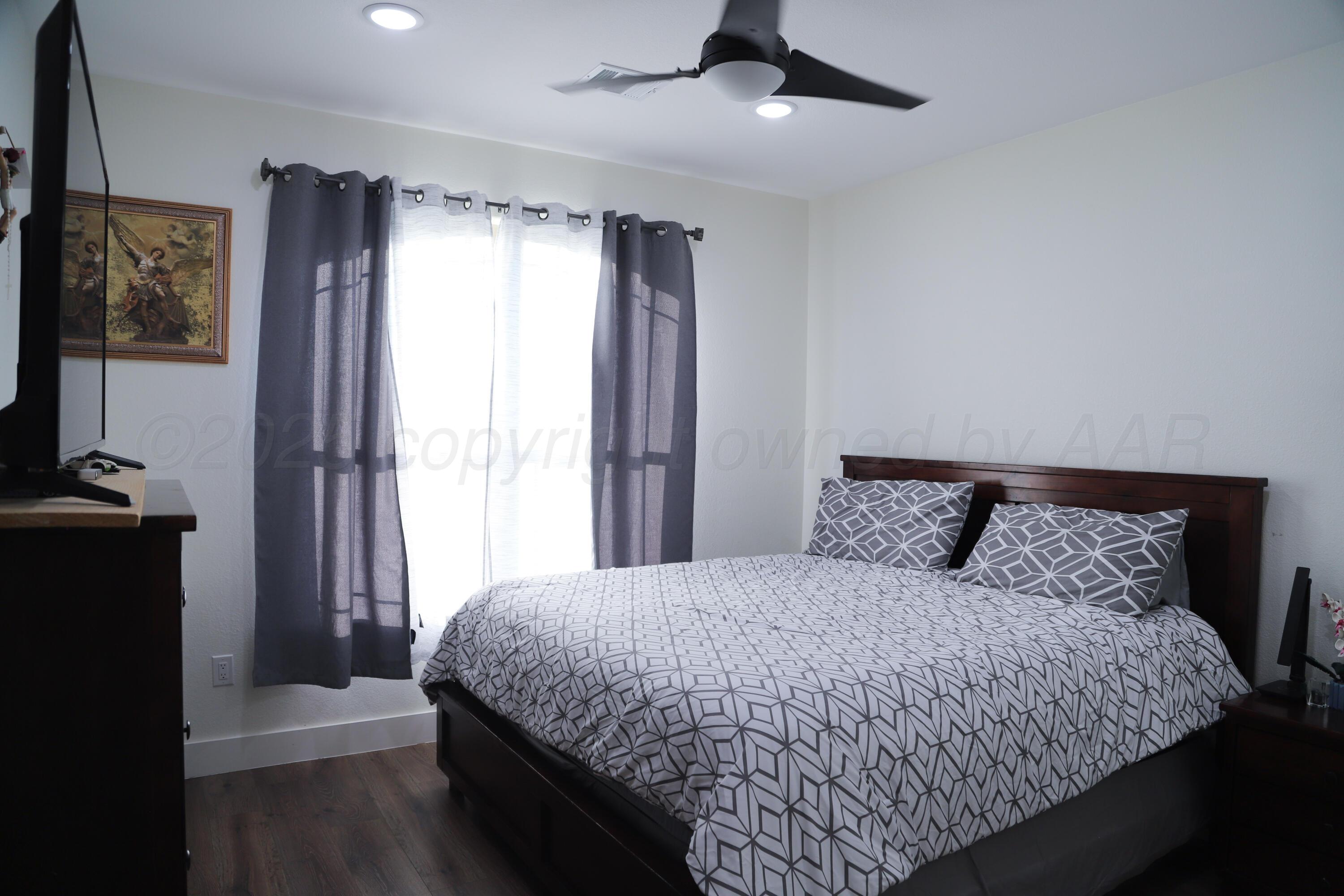 11501 Cutter Lane Amarillo, TX 79118 - Photo 19 of 24 a bedroom with a bed and a window