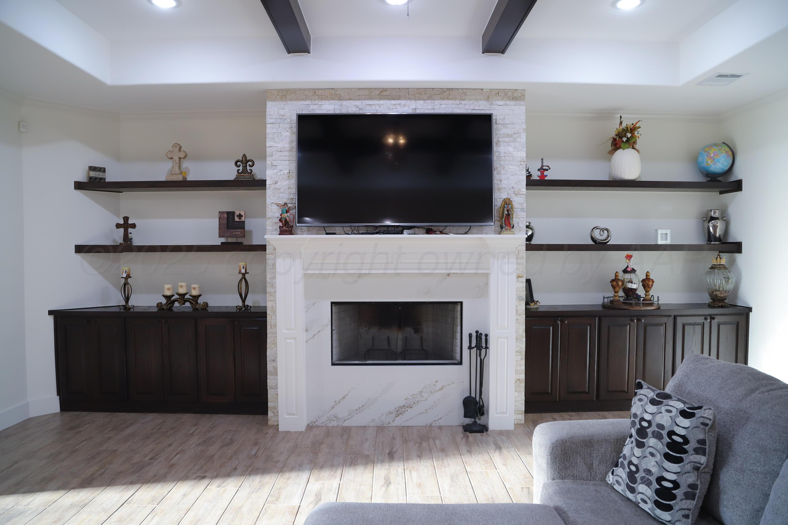 11501 Cutter Lane Amarillo, TX 79118 - Photo 7 of 24 a living room with furniture and a flat screen tv