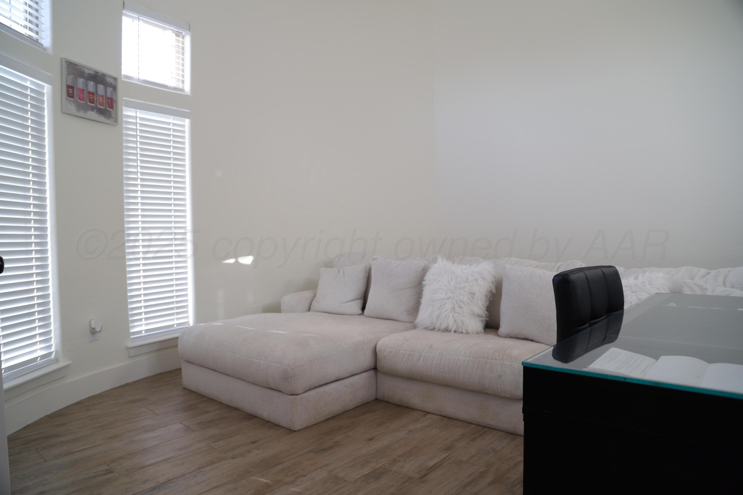 11501 Cutter Lane Amarillo, TX 79118 - Photo 10 of 24 a living room with furniture and a window