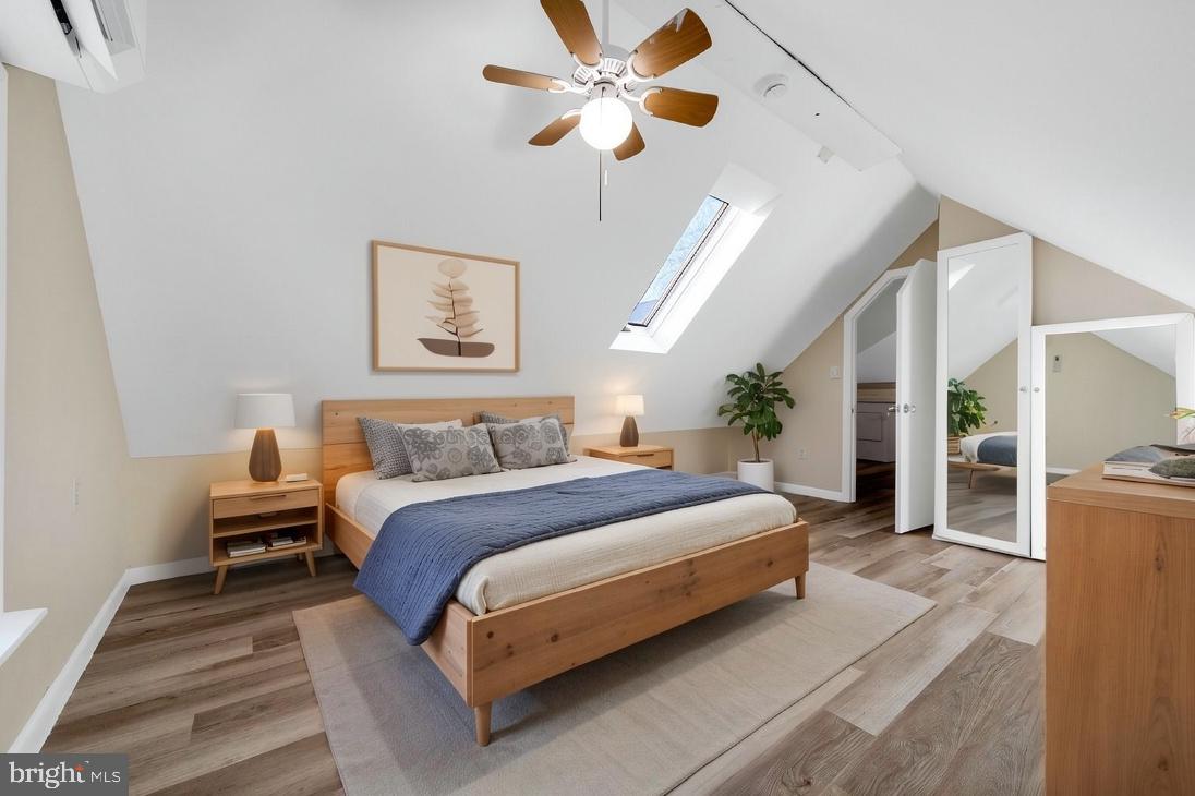 724 Hunter Street Gloucester City, NJ 08030 - Photo 14 of 47 a spacious bedroom with a bed and a chandelier