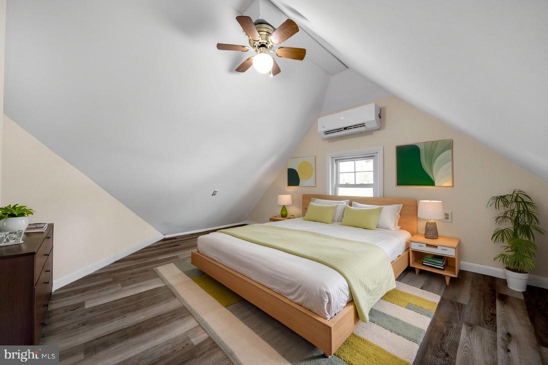 724 Hunter Street Gloucester City, NJ 08030 - Photo 17 of 47 a bedroom with a bed and a chandelier