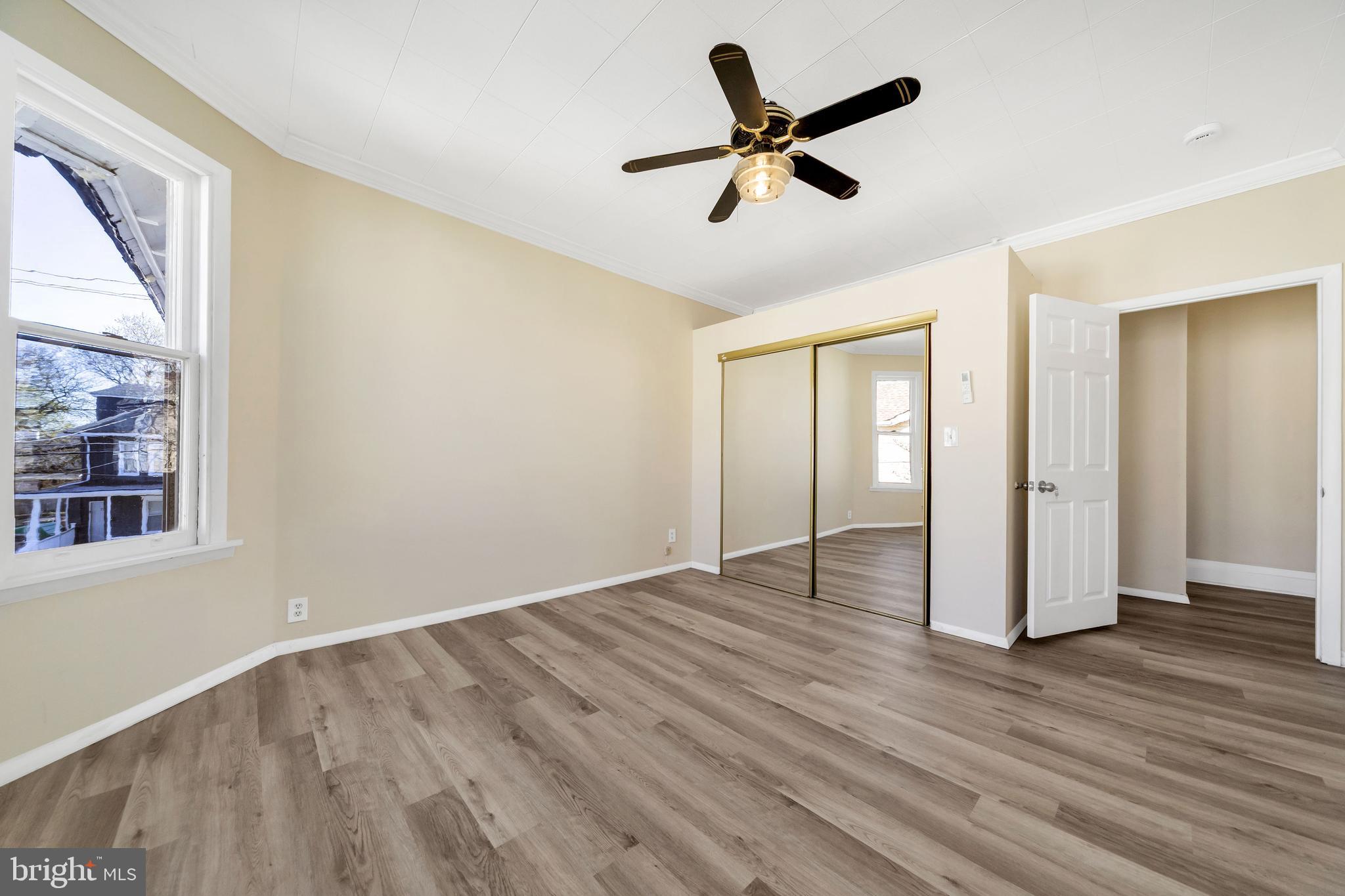 724 Hunter Street Gloucester City, NJ 08030 - Photo 24 of 47 wooden floor in an empty room with a window