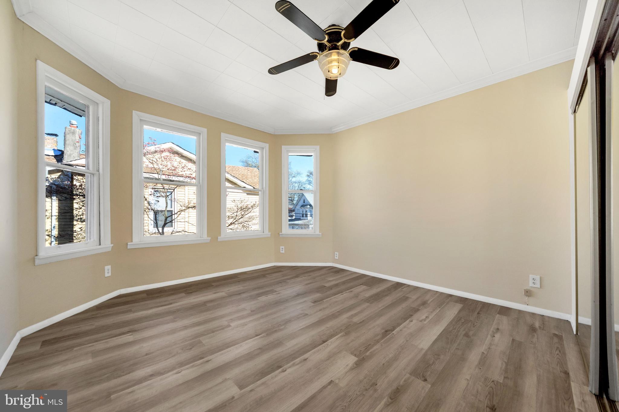 724 Hunter Street Gloucester City, NJ 08030 - Photo 25 of 47 wooden floor in an empty room with a window