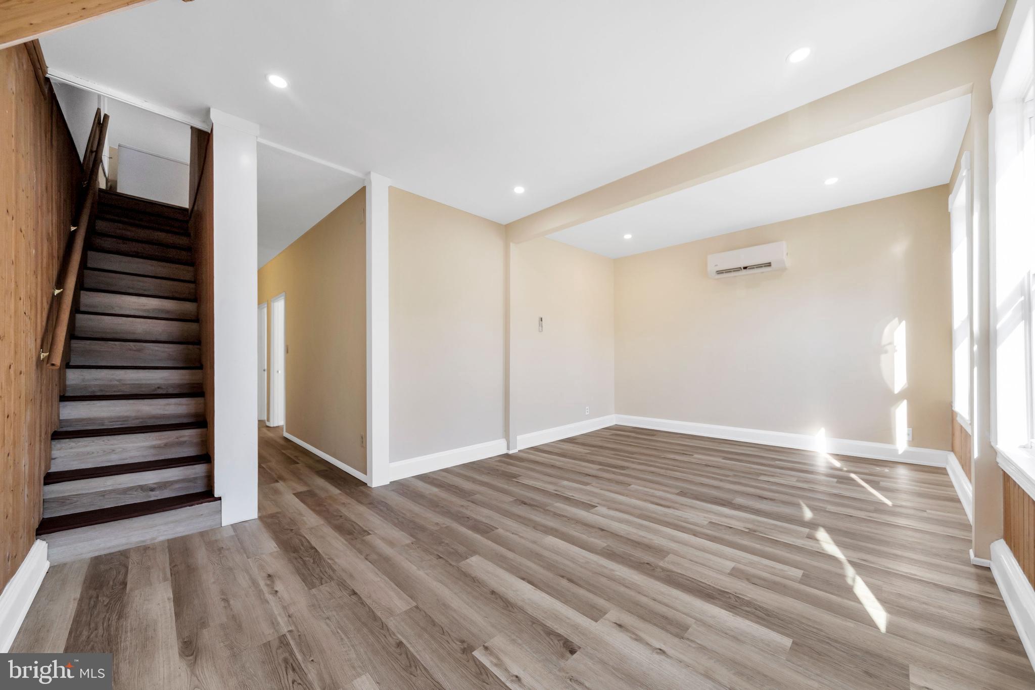 724 Hunter Street Gloucester City, NJ 08030 - Photo 26 of 47 a view of hallway with stairs and wooden floor