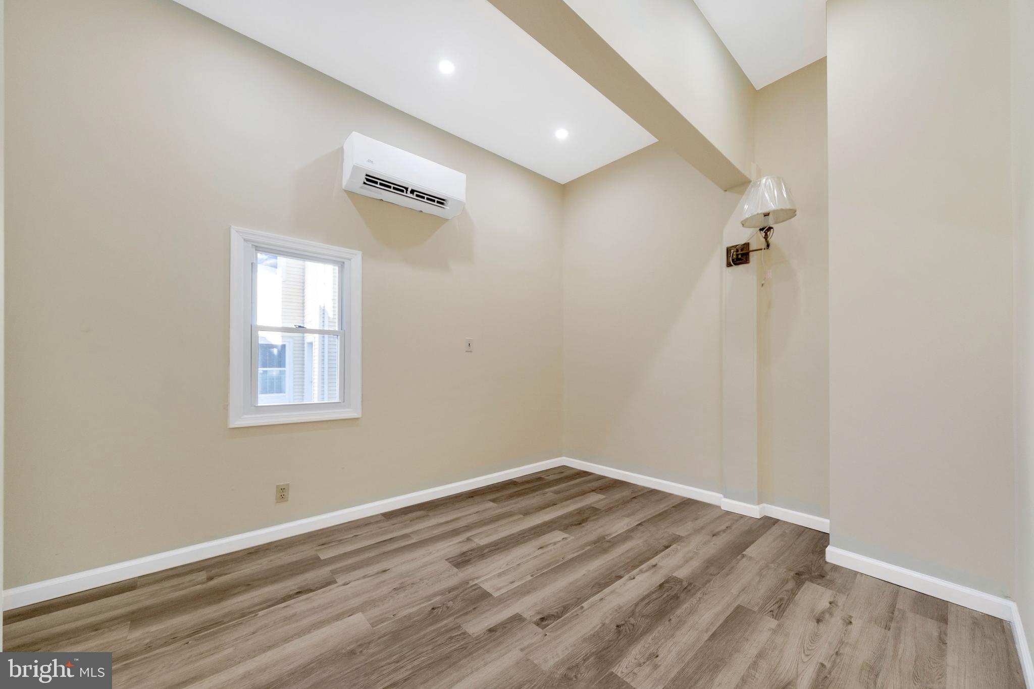 724 Hunter Street Gloucester City, NJ 08030 - Photo 35 of 47 a view of a room with wooden floor and window