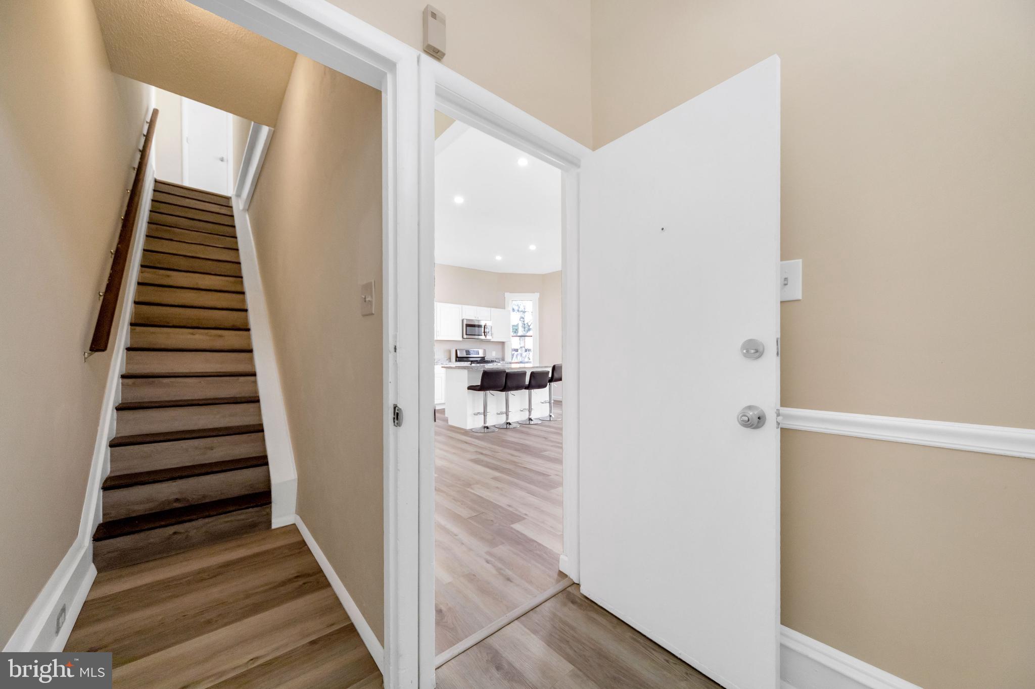 724 Hunter Street Gloucester City, NJ 08030 - Photo 5 of 47 a view of a hallway with wooden floor and entryway